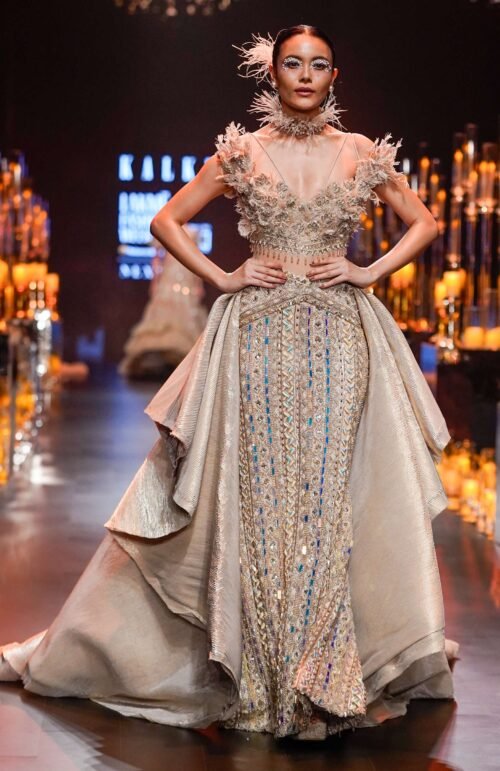Gold Draped Gown With Trail Detail And Heavy Embroidery